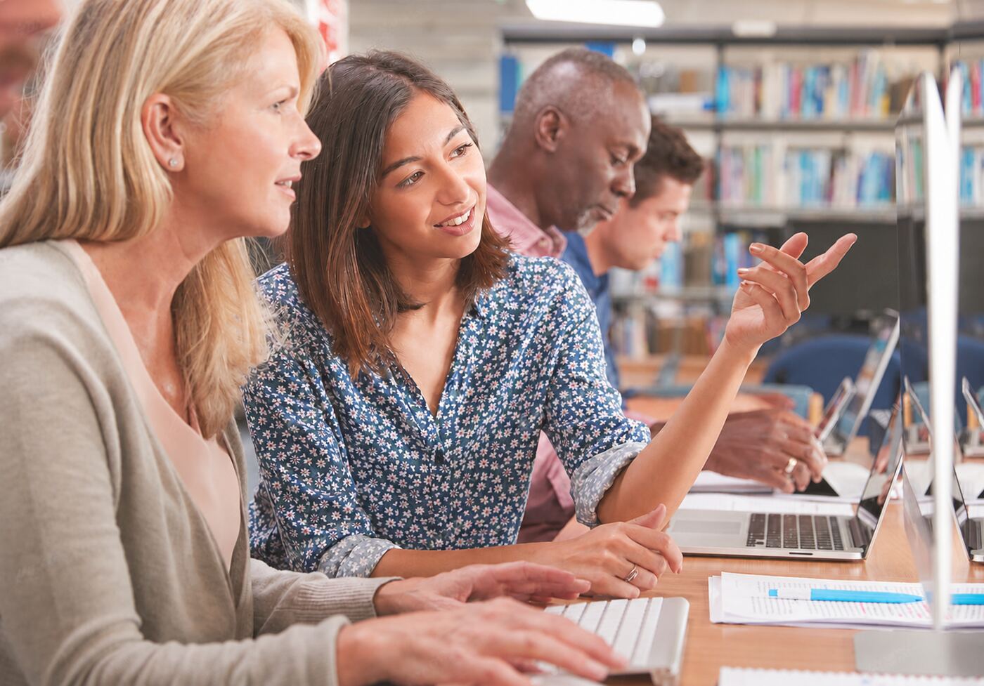 School administrators reviewing accreditation documentation