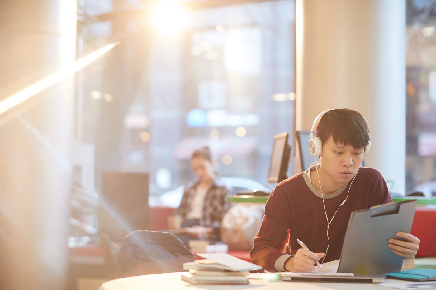 Student studying independently in warm natural light